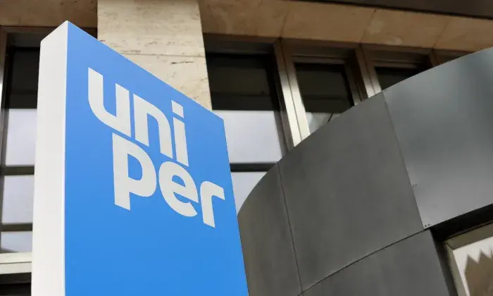 The Uniper logo displayed on a sign outside a modern building, with a combination of glass and dark metal elements.