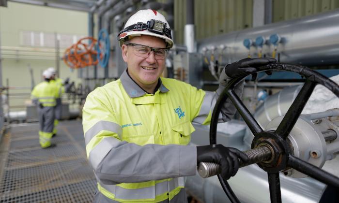 Connah's Quay Man turning big pipe wheel