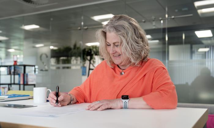 officer worker writing a response