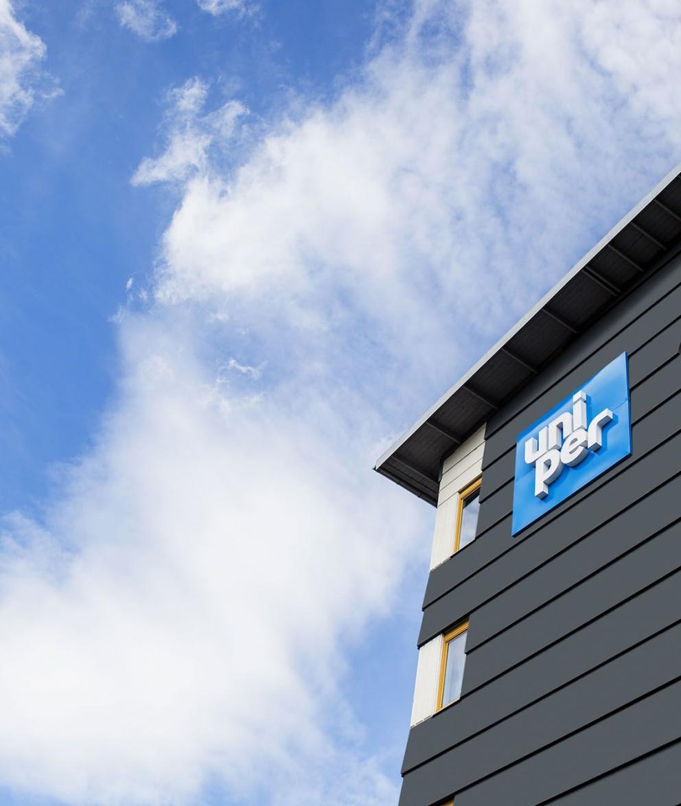 Exterior shot, looking up at the Uniper signage outside a hydro plant