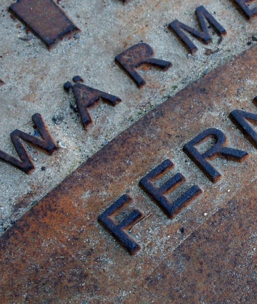 Close up of metal container with embossed lettering