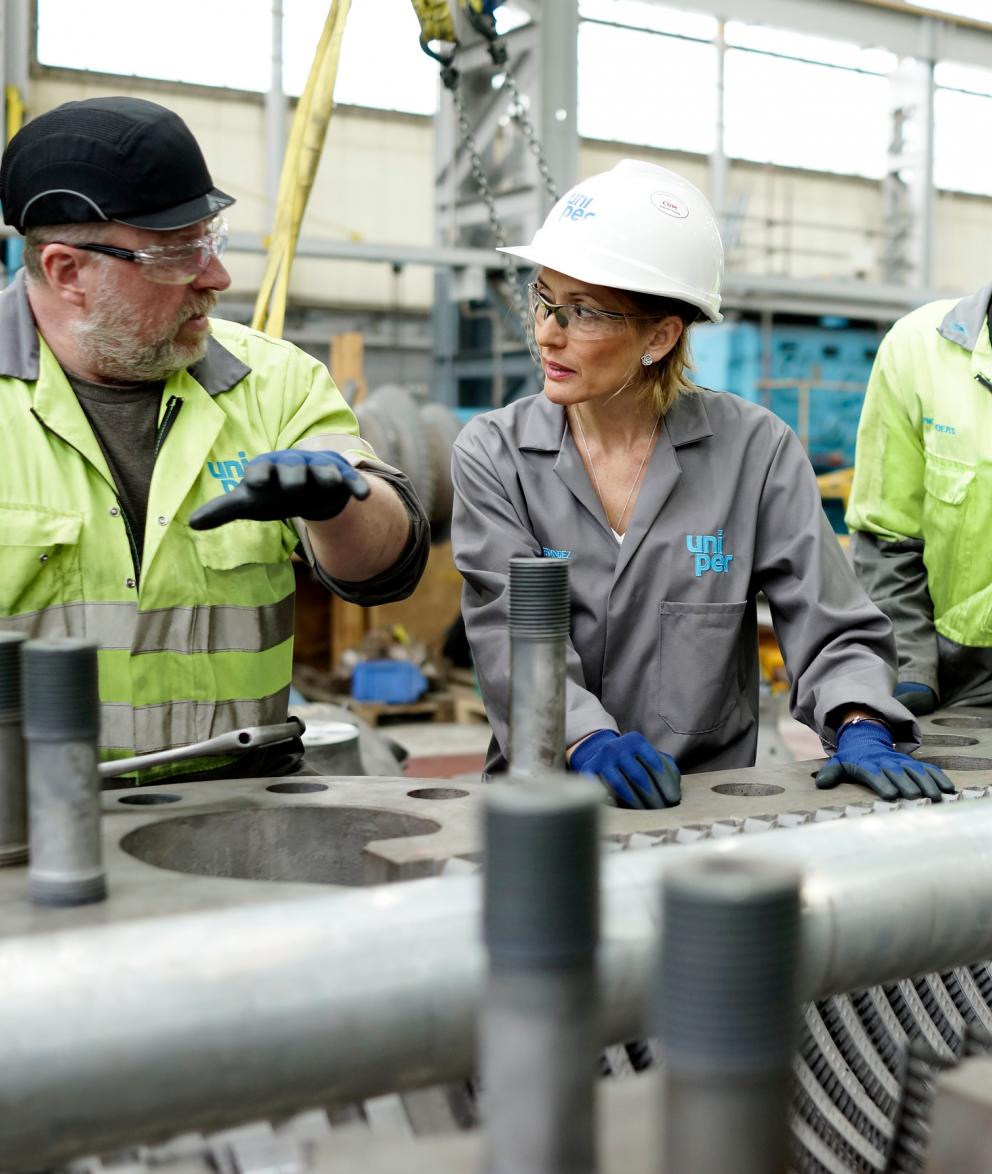 Uniper engineers in discussion at a Power Generation plant