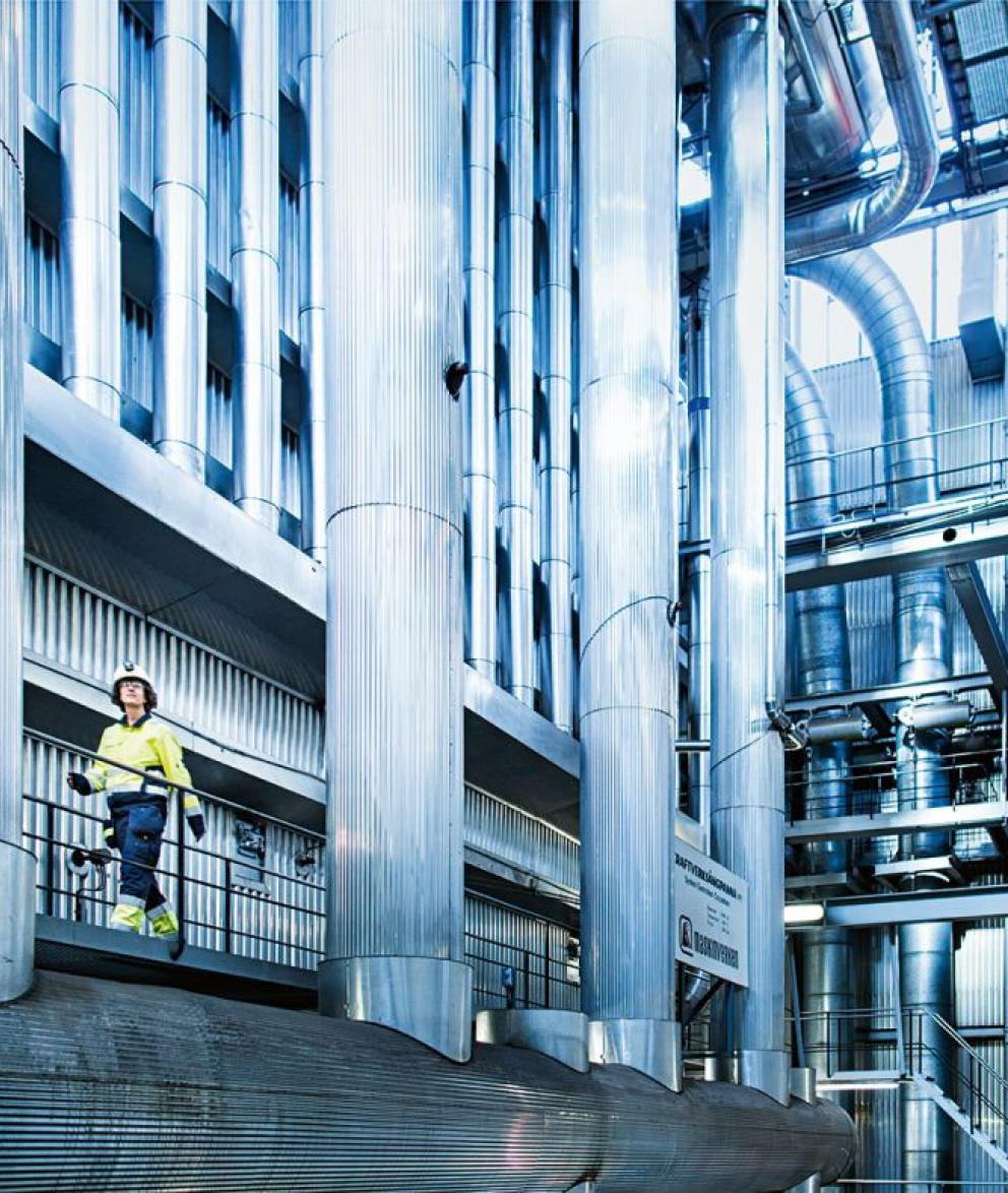 Engineer walking along a huge gas storage facility in Etzel, Germany