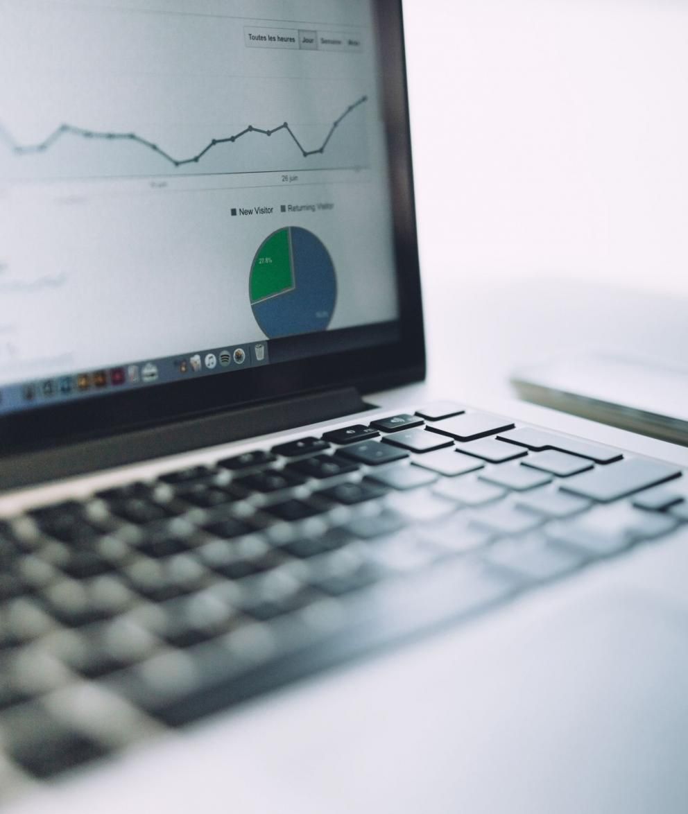 Close up of laptop with graphs and data