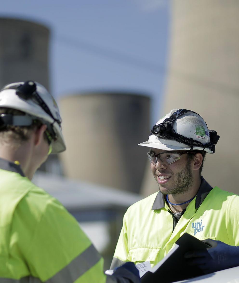 Two engineers in conversation outside Ratcliffe Power Station