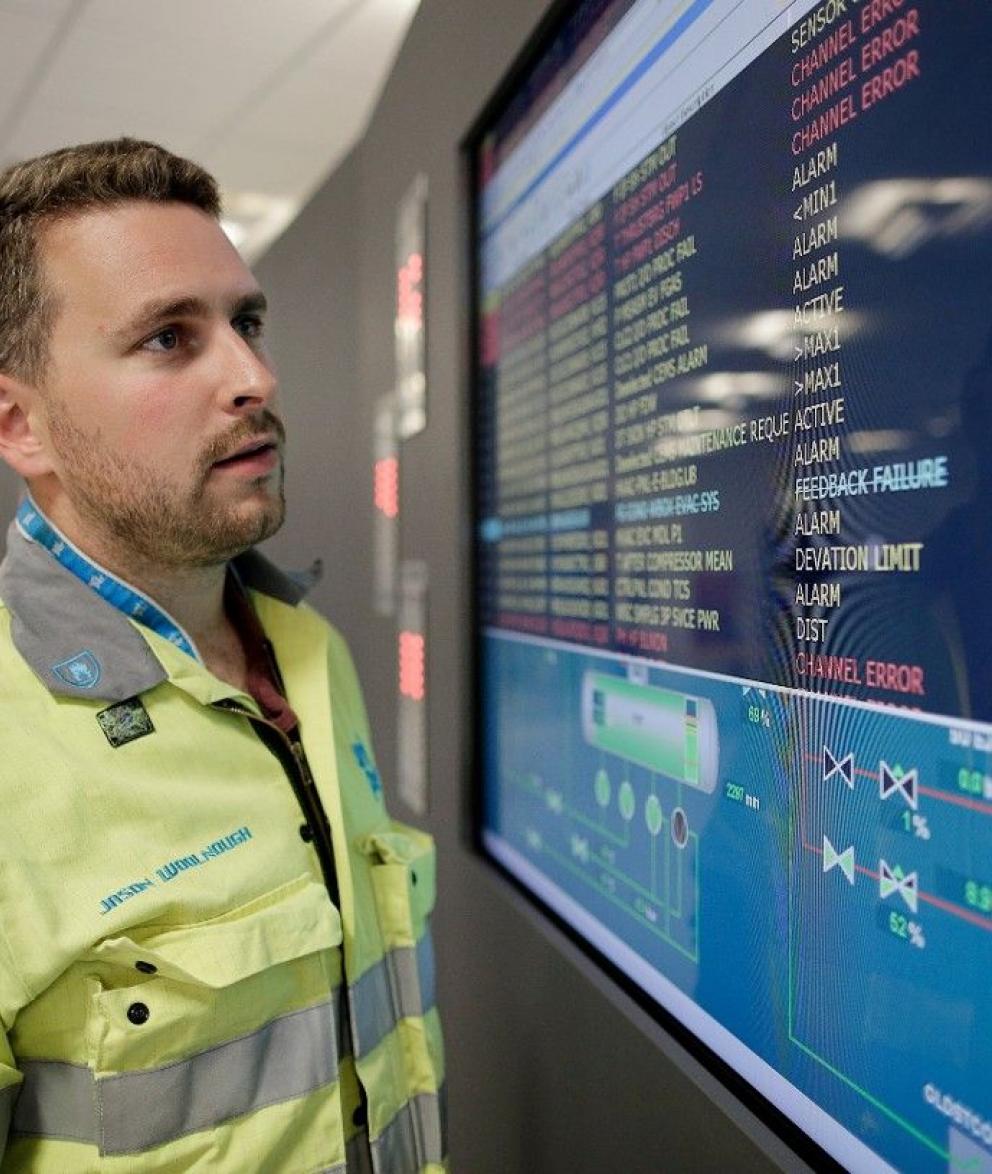 Worker in plant control room