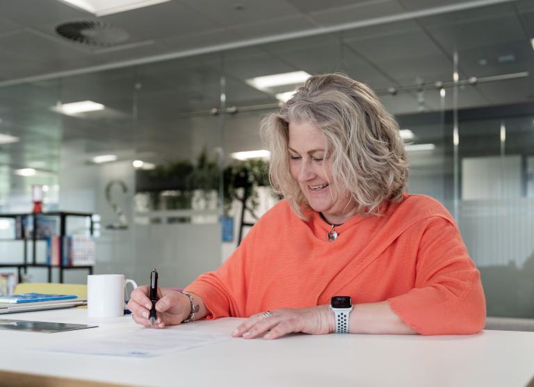 officer worker writing a response