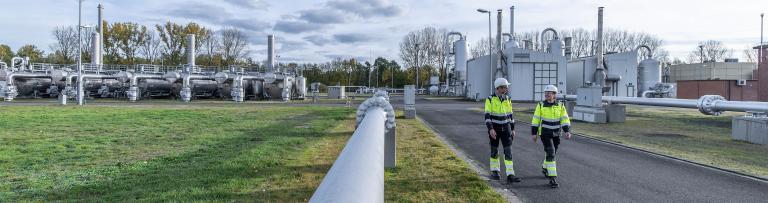 Two Uniper employees walking around a power plant