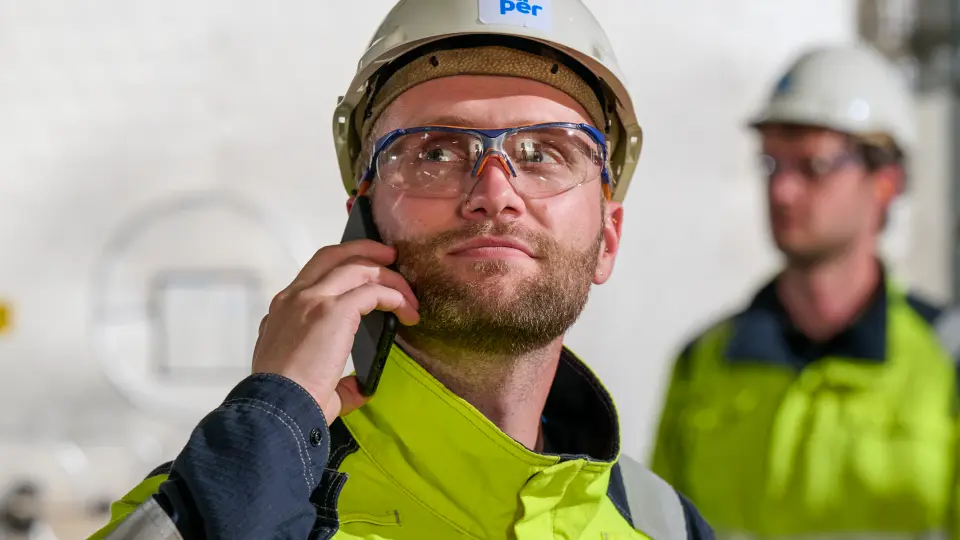 Proud person in work uniform with helmet