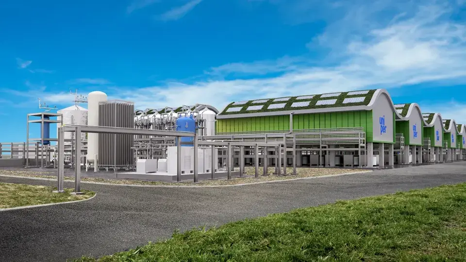 A modern industrial facility with Uniper branding, featuring green-roofed buildings and various large equipment structures, under a bright blue sky.