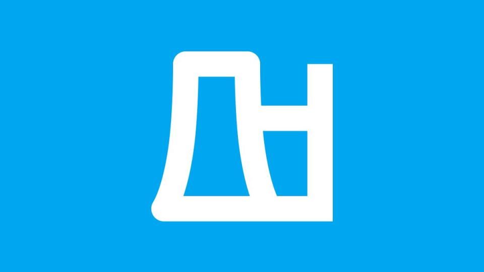 White icon of a factory building with a chimney on a bright blue background, symbolizing industry or energy production.