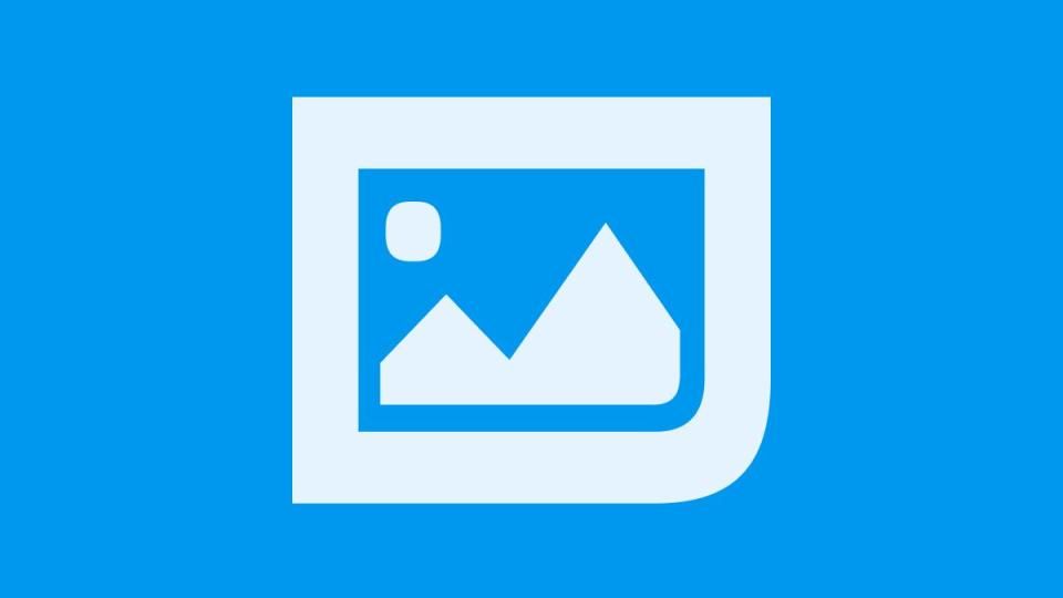 White icon of a framed picture with mountains and a sun on a bright blue background, symbolizing imagery or media.