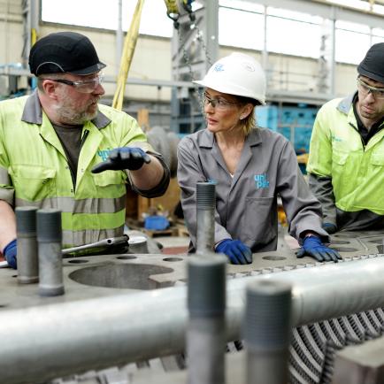Uniper engineers in discussion at a Power Generation plant