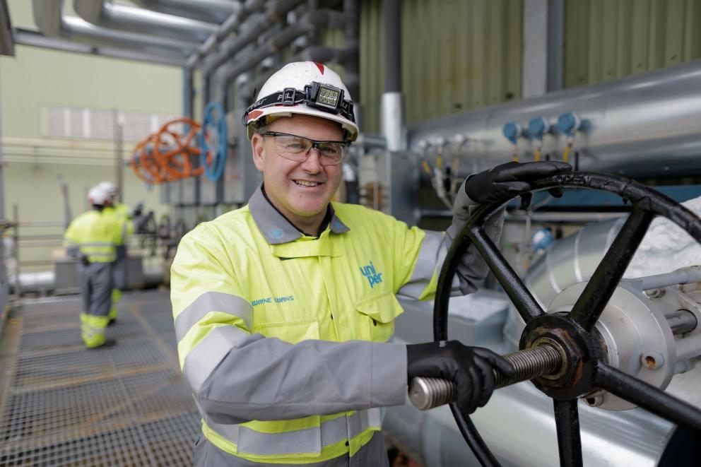 Connah's Quay Man turning big pipe wheel