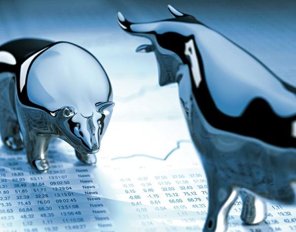 Stock image of bear and bull statues on a spreadsheet