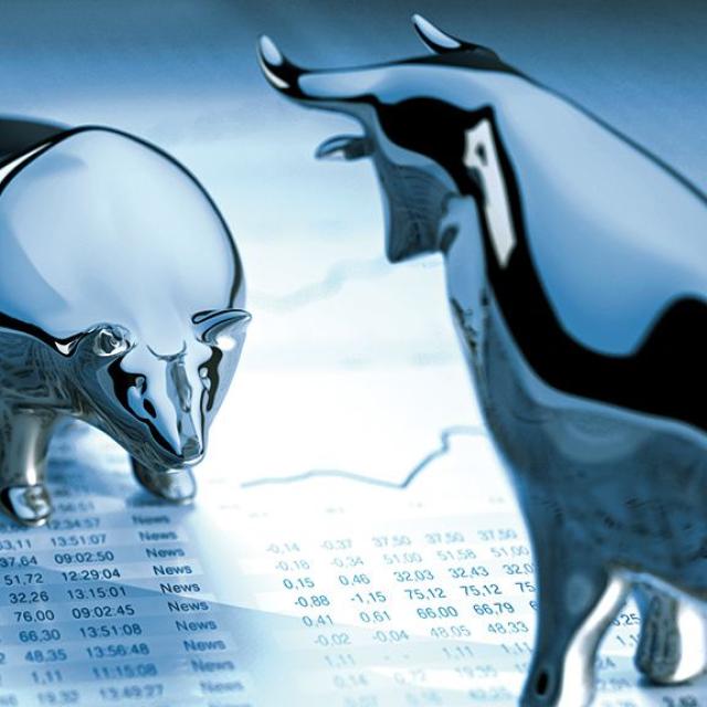 Stock image of bear and bull statues on a spreadsheet